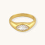 Gold ring with a clear gemstone on a white background