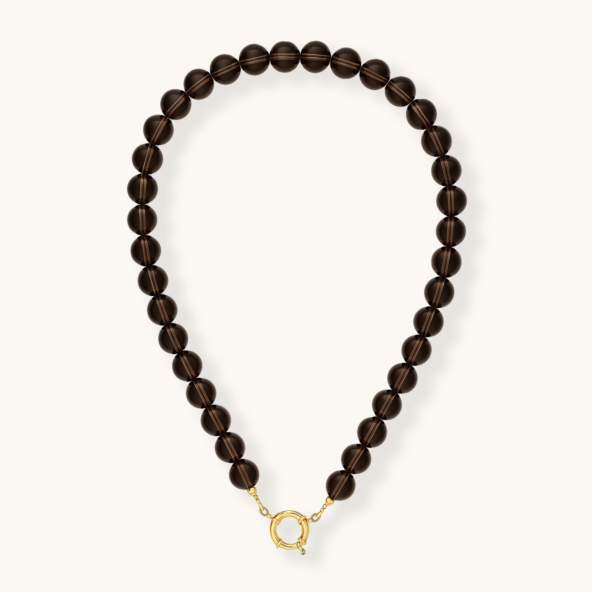 Beaded necklace with gold clasp on a white background