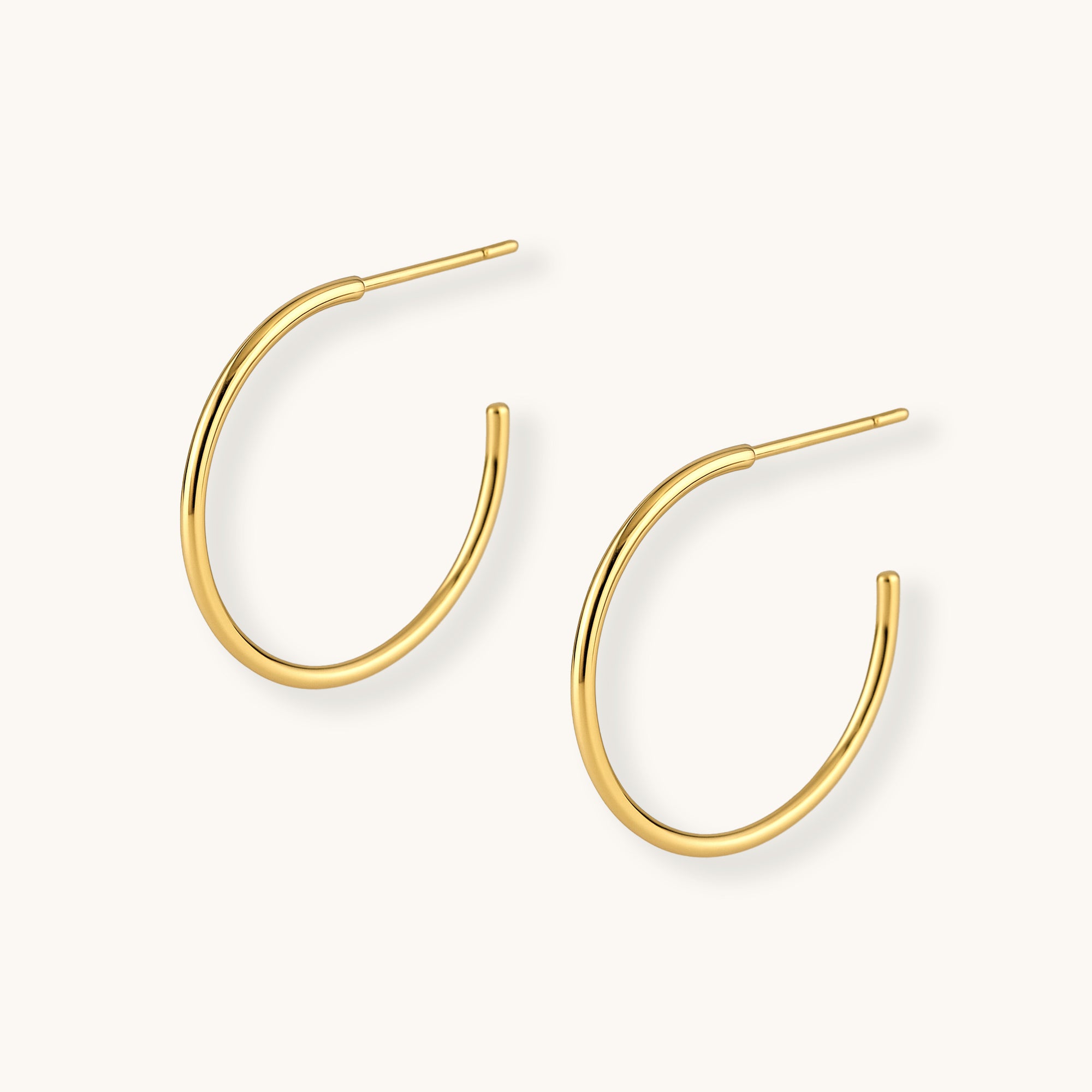 Gold hoop earrings on a white background