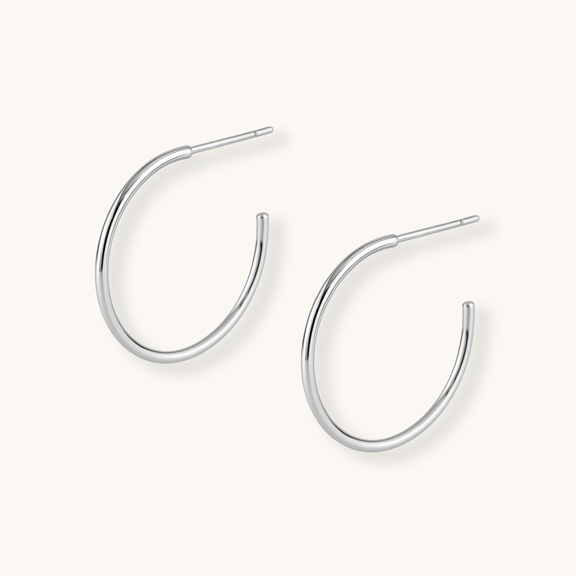 Silver hoop earrings on a white background