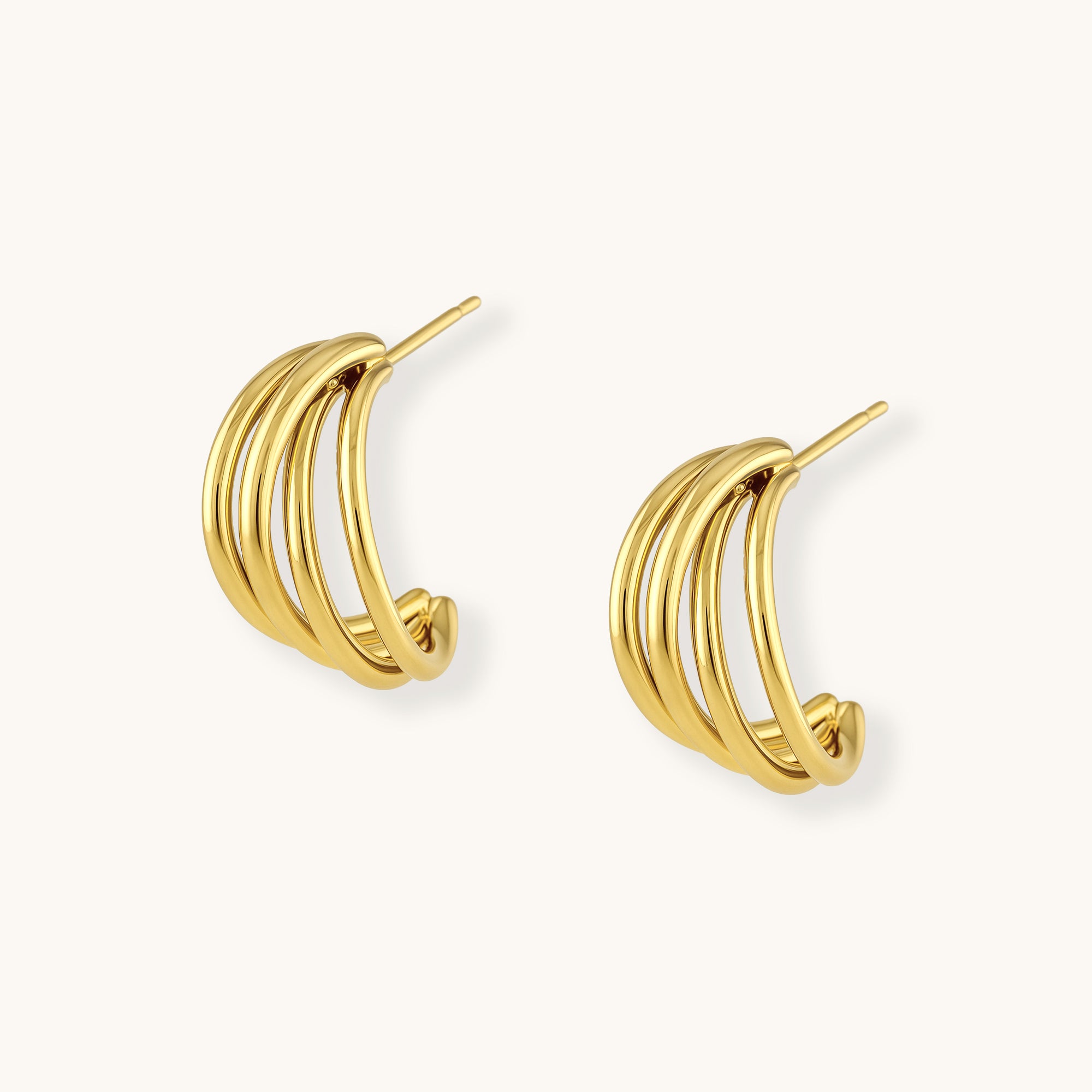 Gold hoop earrings on a white background